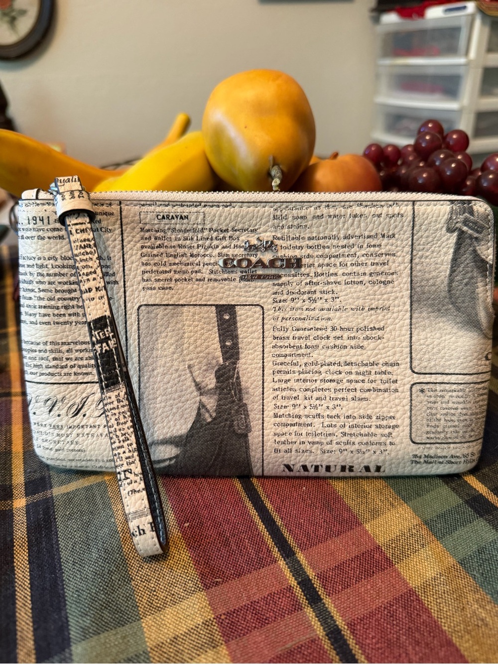 Coach newsprint wristlet